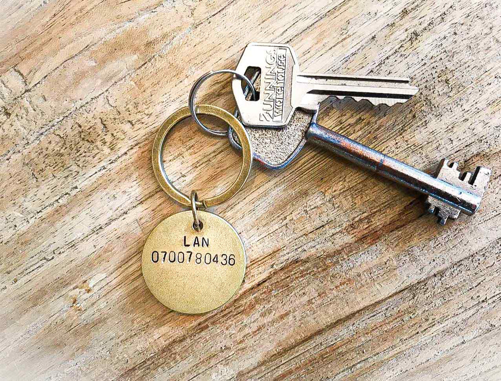key chain hand stamped with keys on timber